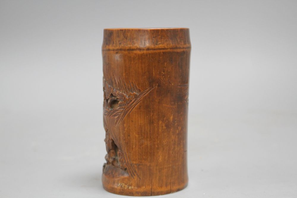 A Chinese bamboo brush pot, carved with scholars playing weiqi, late 19th/early 20th century H. 11.7cm